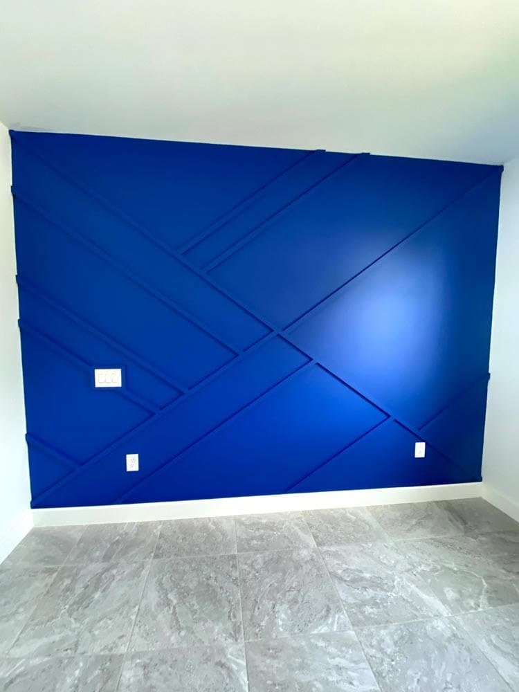 Blue accent wall painted by Ultimate Services