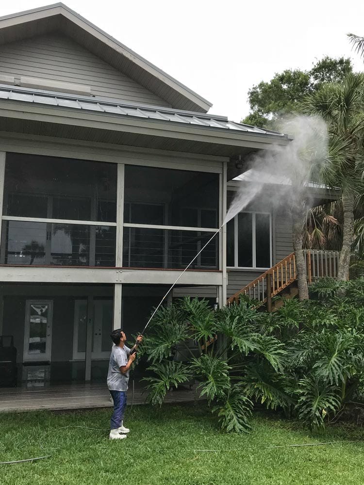 Pressure cleaning a home exterior, from the Ultimate Services website