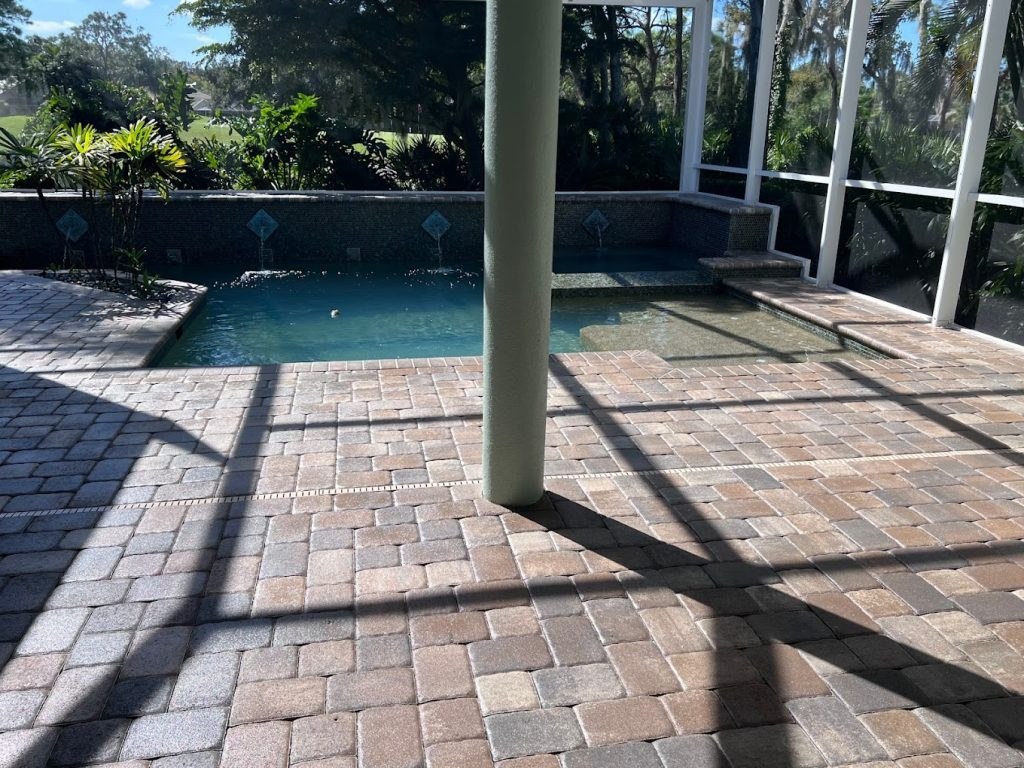 Sealed paver pool deck from the Ultimate Services website